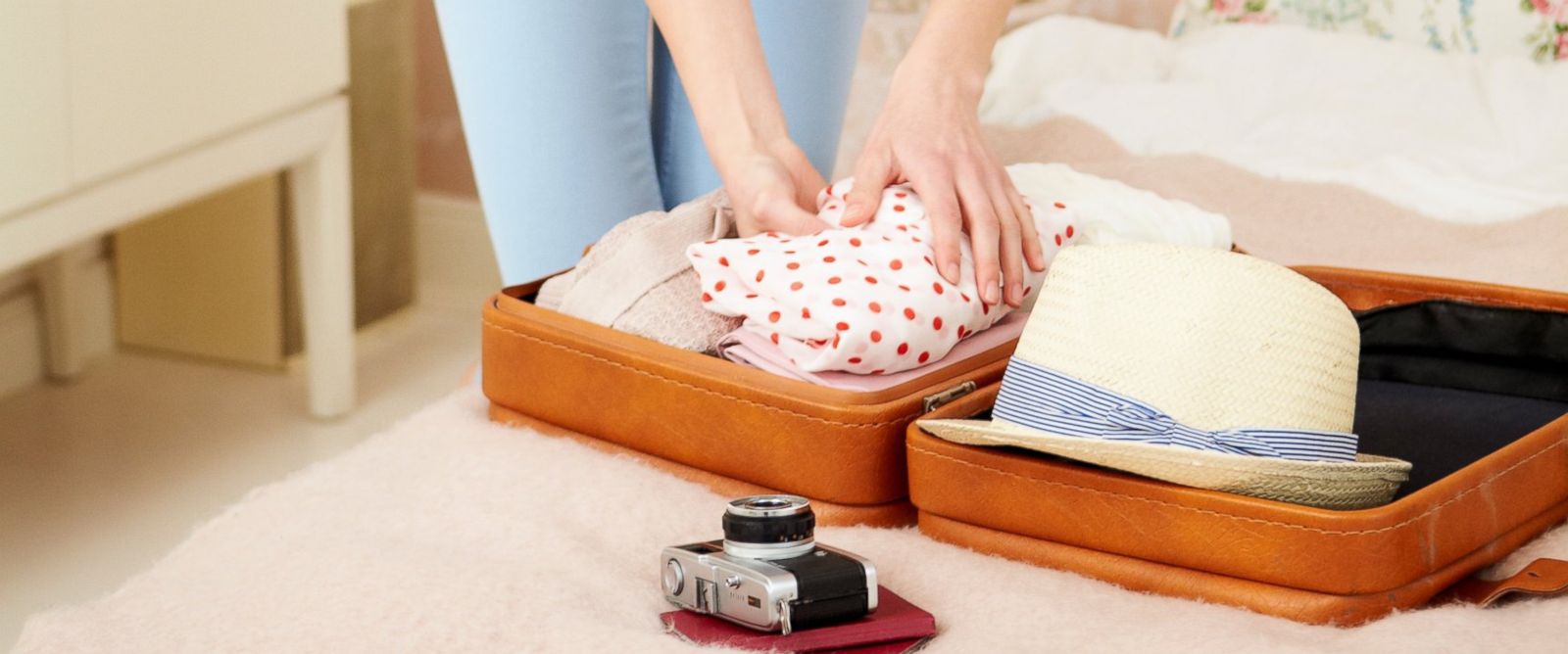 gty_women_packing_suitcase_mm_150619_12x5_1600
